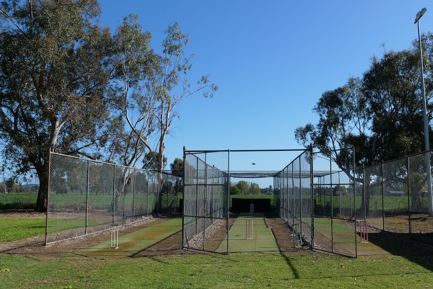 A shot of outside cricket nets with noone around. 