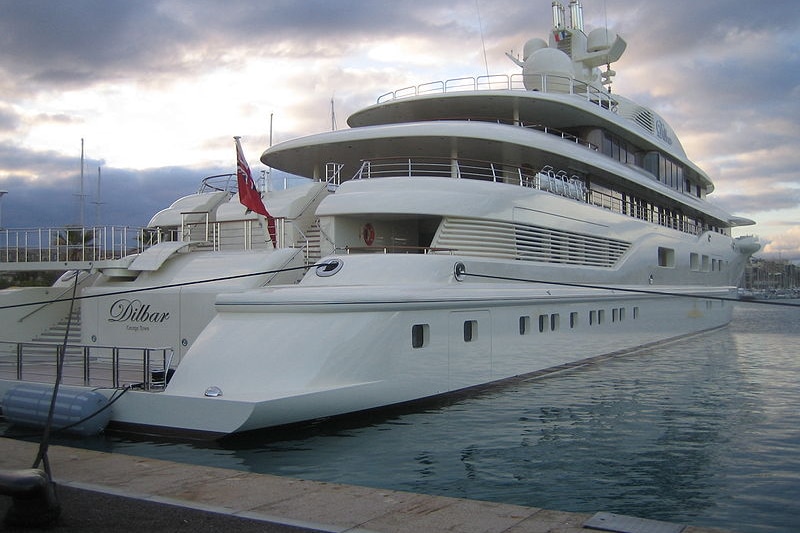 A massive boat docked in a port 