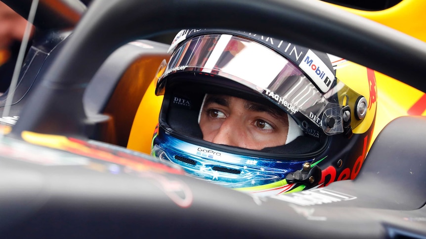 Dan Ricciardo looks out from his Red Bull car