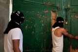 Masked Palestinians secure door to al-Aqsa mosque