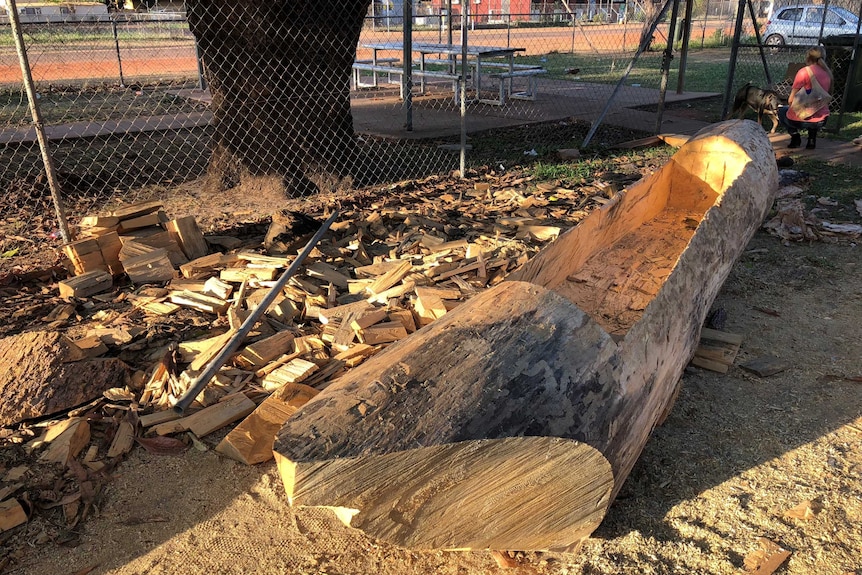 photo of wood being used to build canoe