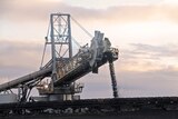 Coal coming off a conveyer belt at a mine