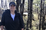 A woman smiling in bushland