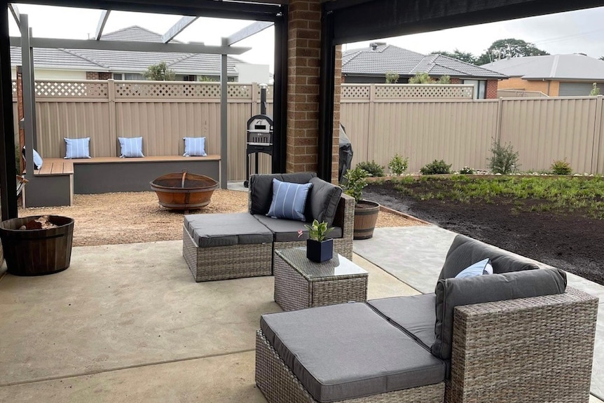 a backyard garden with couches.