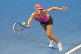 Maria Sharapova stretches for a return against Serena Williams at the Brisbane International