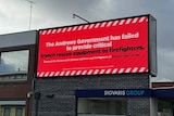 red coloured billboard in ballarat which reads the andrews government has failed to provide critical trench rescue equipment