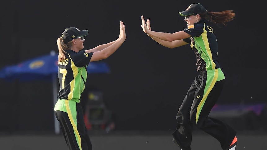 Australia's Megan Schutt and Meg Lanning celebrate World Twenty20 win over England