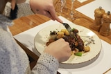 meat being eaten a restaurant