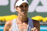 Ajla Tomljanovic pumps her fist and looks pleased after a point