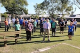 Some nurses and medical staff in Rockhampton socially distance for a group photo in a park.