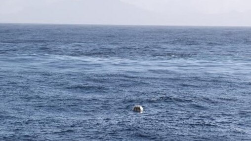 Yelloe wave-measuring buoy in the ocean.