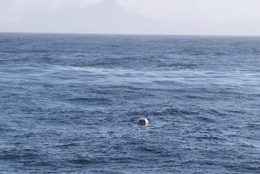 Yelloe wave-measuring buoy in the ocean.