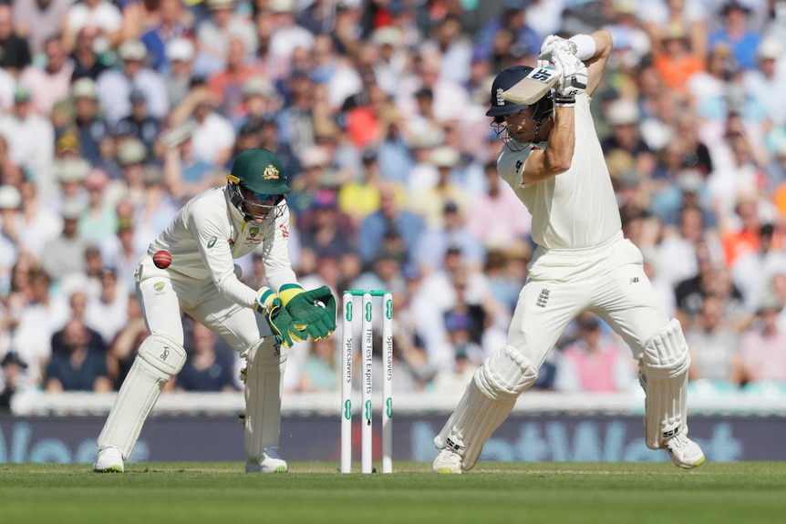 Denly plays off the back foot into the onside, while Tim Paine watches on behind the stumps.