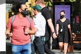 People walking in Perth's CBD wearing face masks.