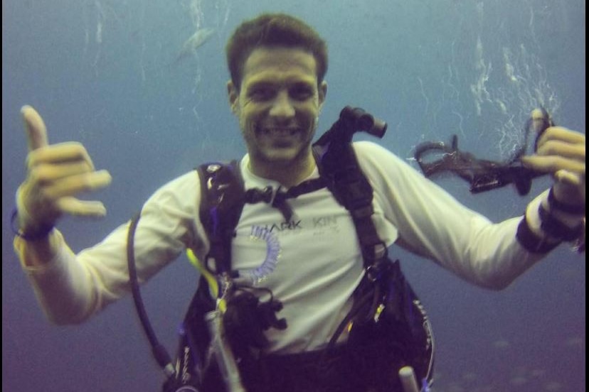 a man under water smiling