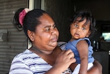 Tara Donation with her 8-month-old son in Kalumburu.