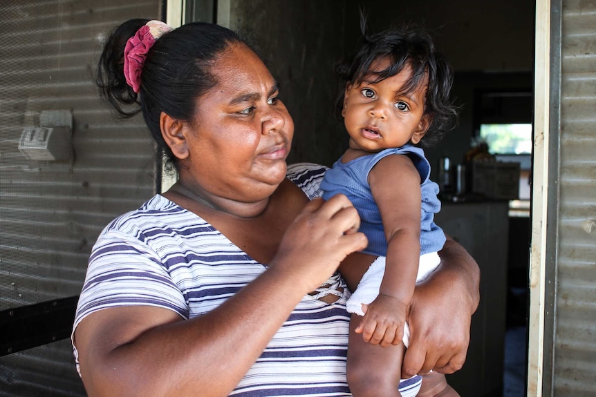 Tara Donation with her 8-month-old son in Kalumburu.