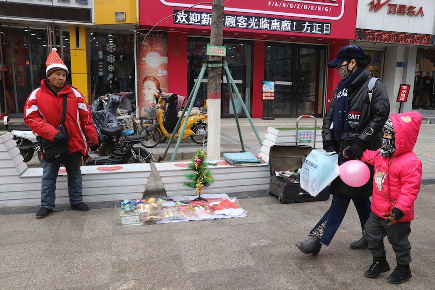 A man sells Christmas decorations on a street of Zhangjiakou in northern China's Hebei province.