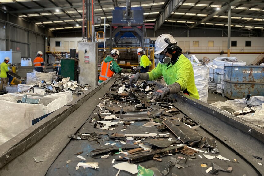 workers sort e-waste scraps