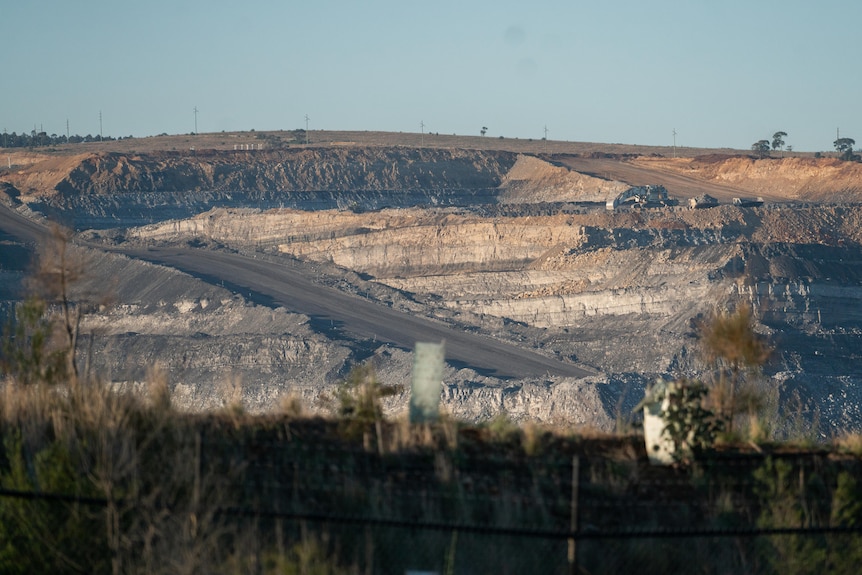 A hill with a coal mine cut out of the side