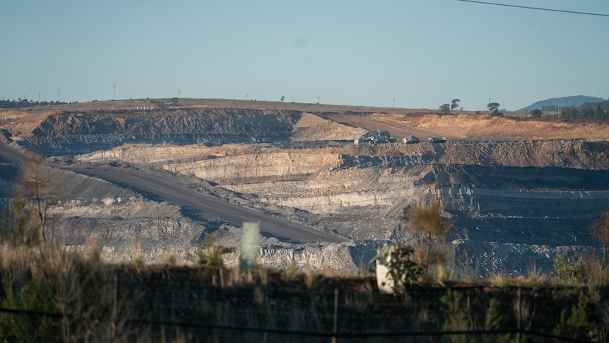 A hill with a coal mine cut out of the side