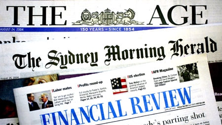 The mastheads of three newspapers owned by Fairfax, laid out on a table.