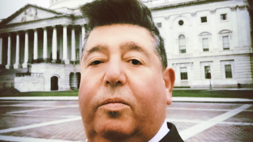 A picture of British publicist, music manager, and former tabloid journalist Rob Goldstone outside a building in Washington DC