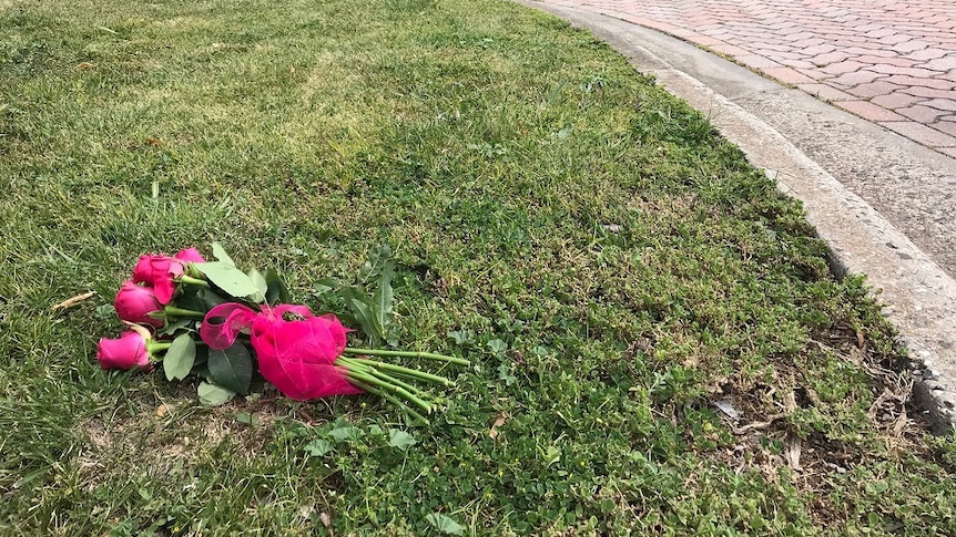 flowers lying on the ground where the incident