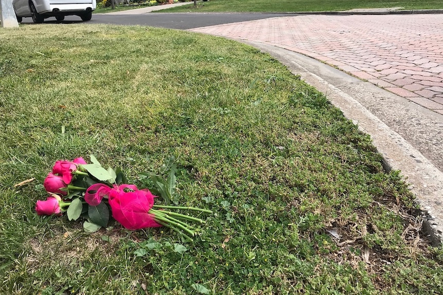 flowers lying on the ground where the incident