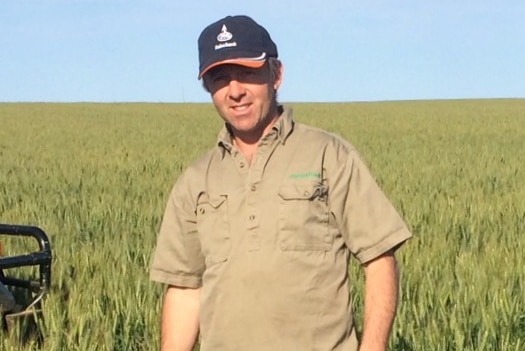 WAFarmers Esperance representative Mic Fels stands in a field.