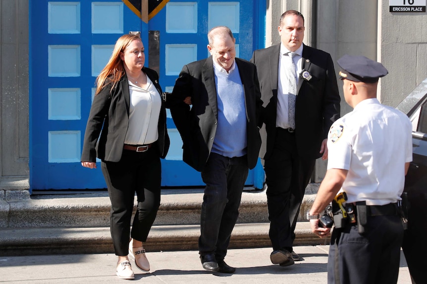 Film producer Harvey Weinstein leaves the 1st Precinct in Manhattan in handcuffs.