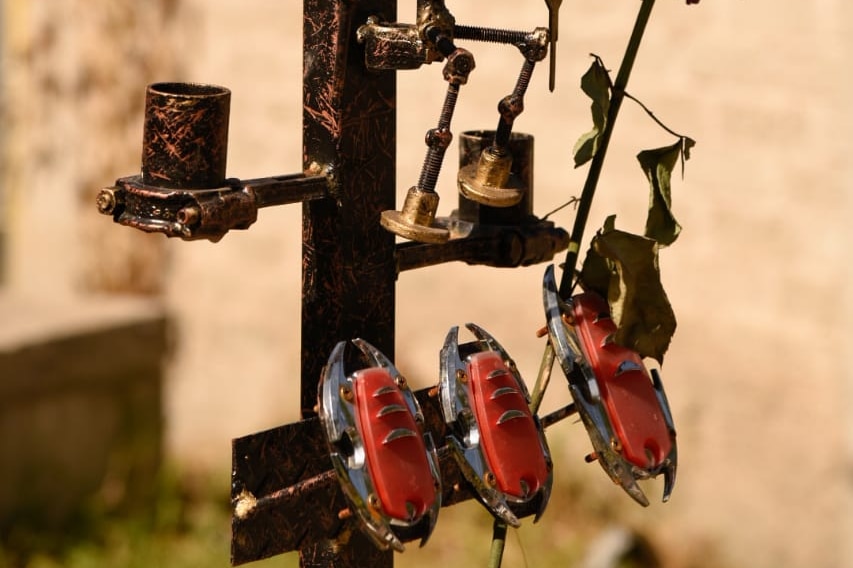 The crucifix that marks the grave of Leonardo 'Leo' Peña Bonillo is made from old car parts.