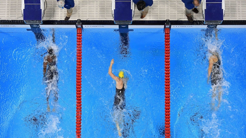 Simone Manuel of the United States touches the wall to win gold in the women's 100m freestyle final.