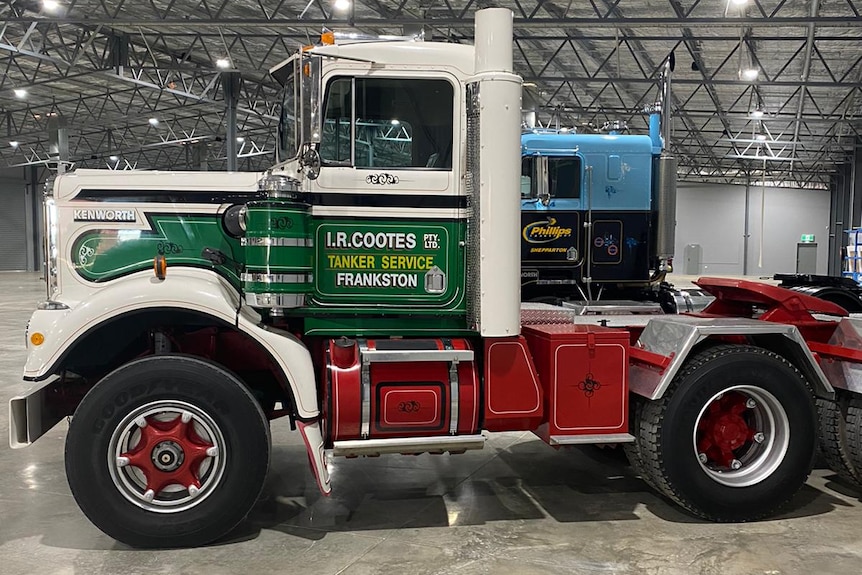 A truck in a large shed.