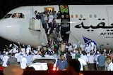 Welcomed back: Megrahi is greeted as he arrives in Libya