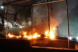 A fire burns at the Moria migrant detention camp on the Greek island of Lesbos, following clashes between migrants and refugees