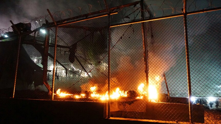 A fire burns at the Moria migrant detention camp on the Greek island of Lesbos, following clashes between migrants and refugees