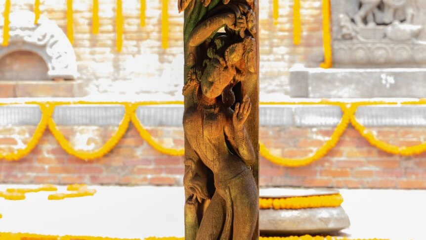 A wooden carving depicting a woman 