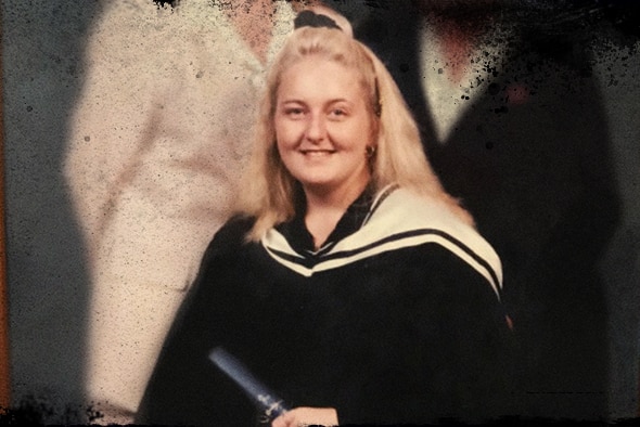 Nicola Gobbo sitting holding a degree