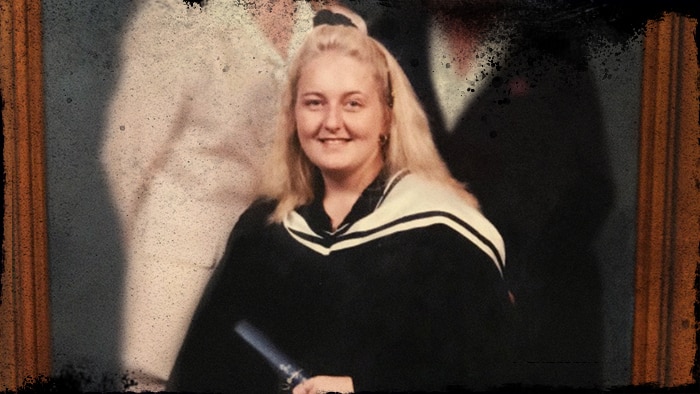 Nicola Gobbo sitting holding a degree