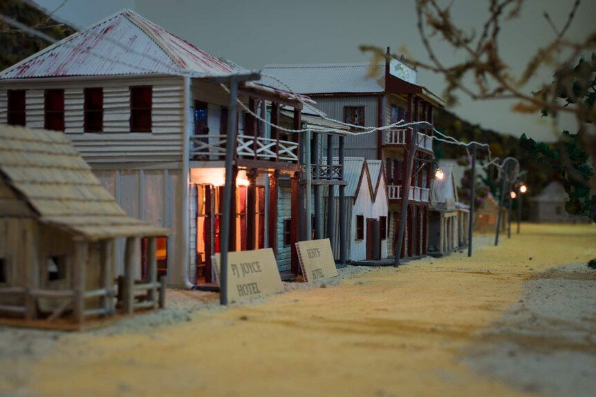 A series of miniature models forming a streetscape.