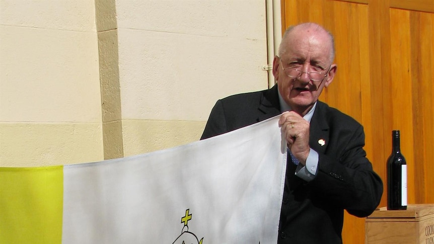 Tim Fischer with the Vatican flag