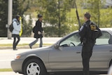 A police officer guards the perimeter of the Virginia Tech campus