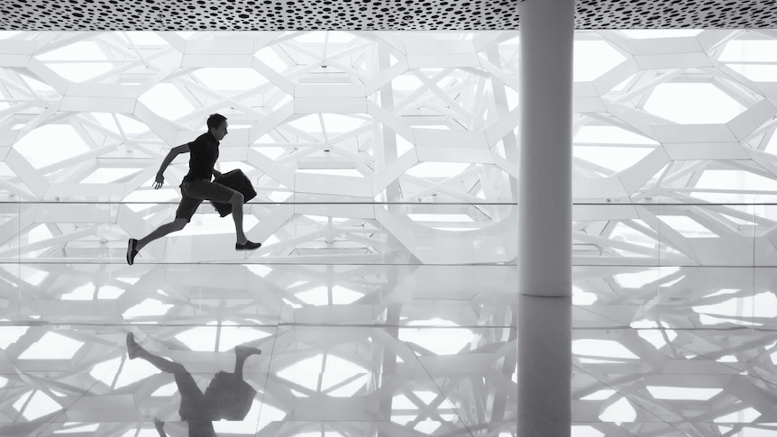 Man running, holding bag, geometrical, hexagonal background