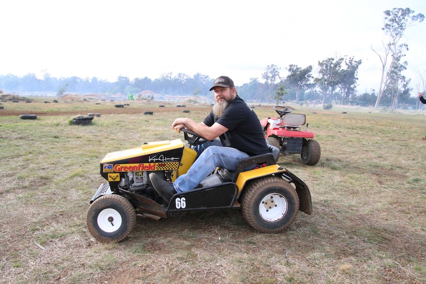 Shane Hamilton on a lawn mower.