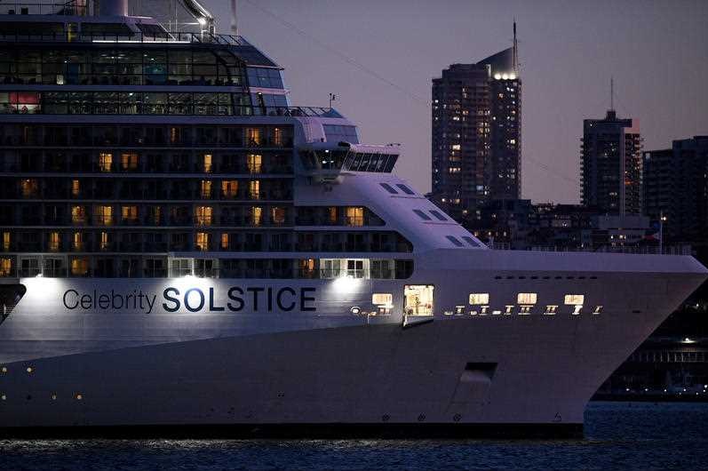 A cruise ship photographed at night in the harbour.
