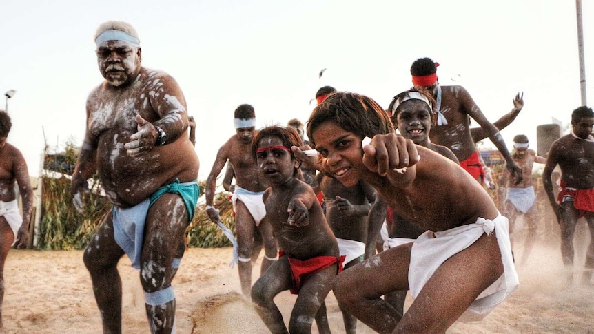 A group of Indigenous dancers performing.