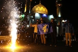 Iranians celebrate on a street, after the IRGC attack on Israel.