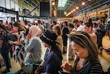 Passengers inside a rail station