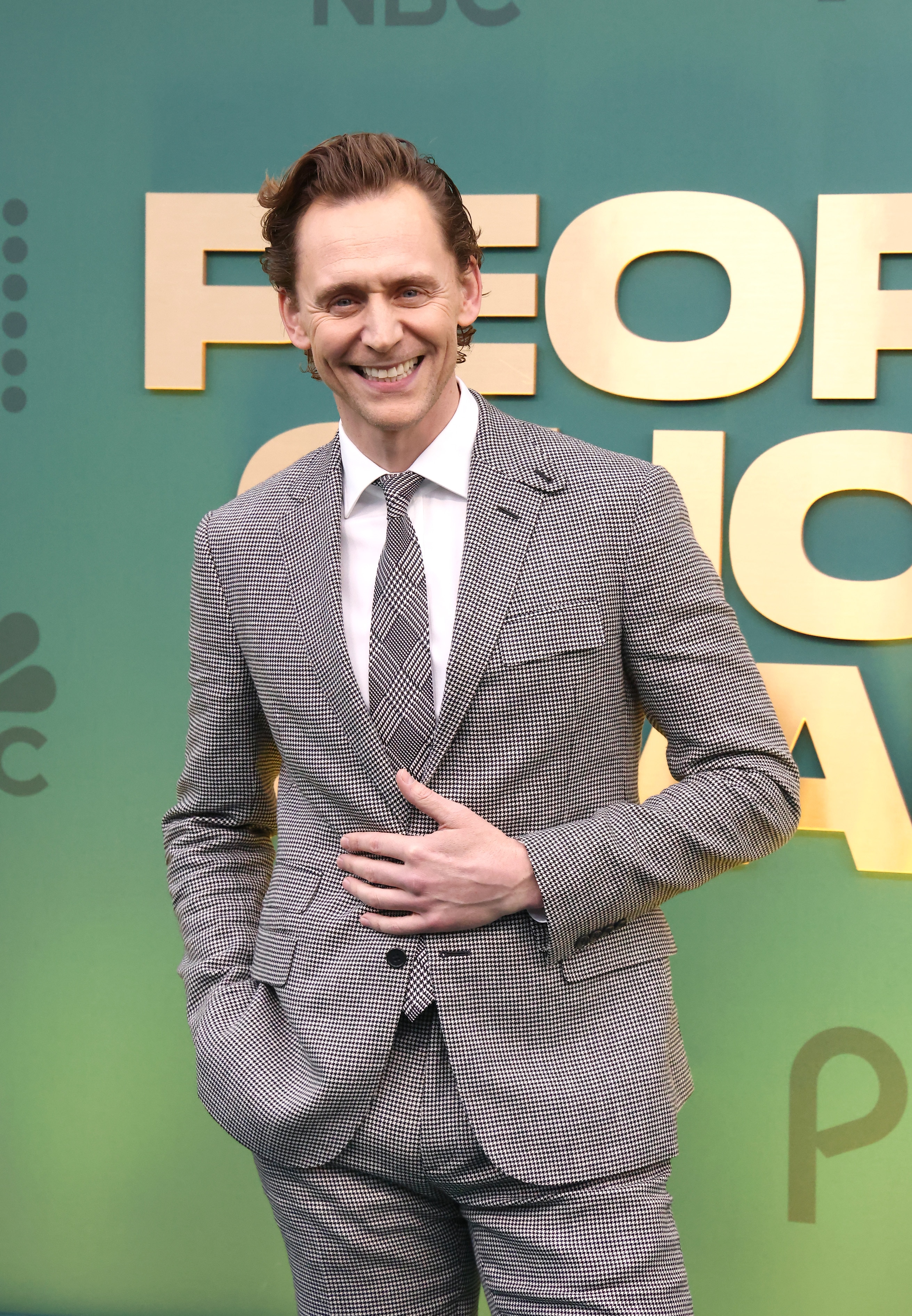 Tom Hiddleston in a finely checkered suit